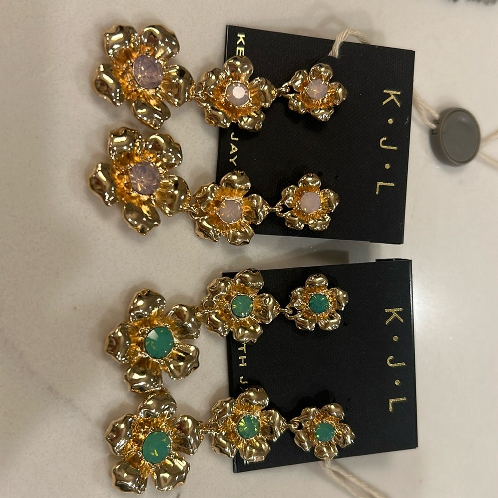 Two pairs of Kenneth Jay Lane earrings.